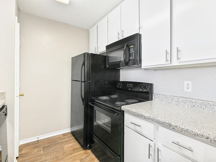 Brookstone Unit Kitchen at Bookstone and Terrace Apartments in Irving, Texas